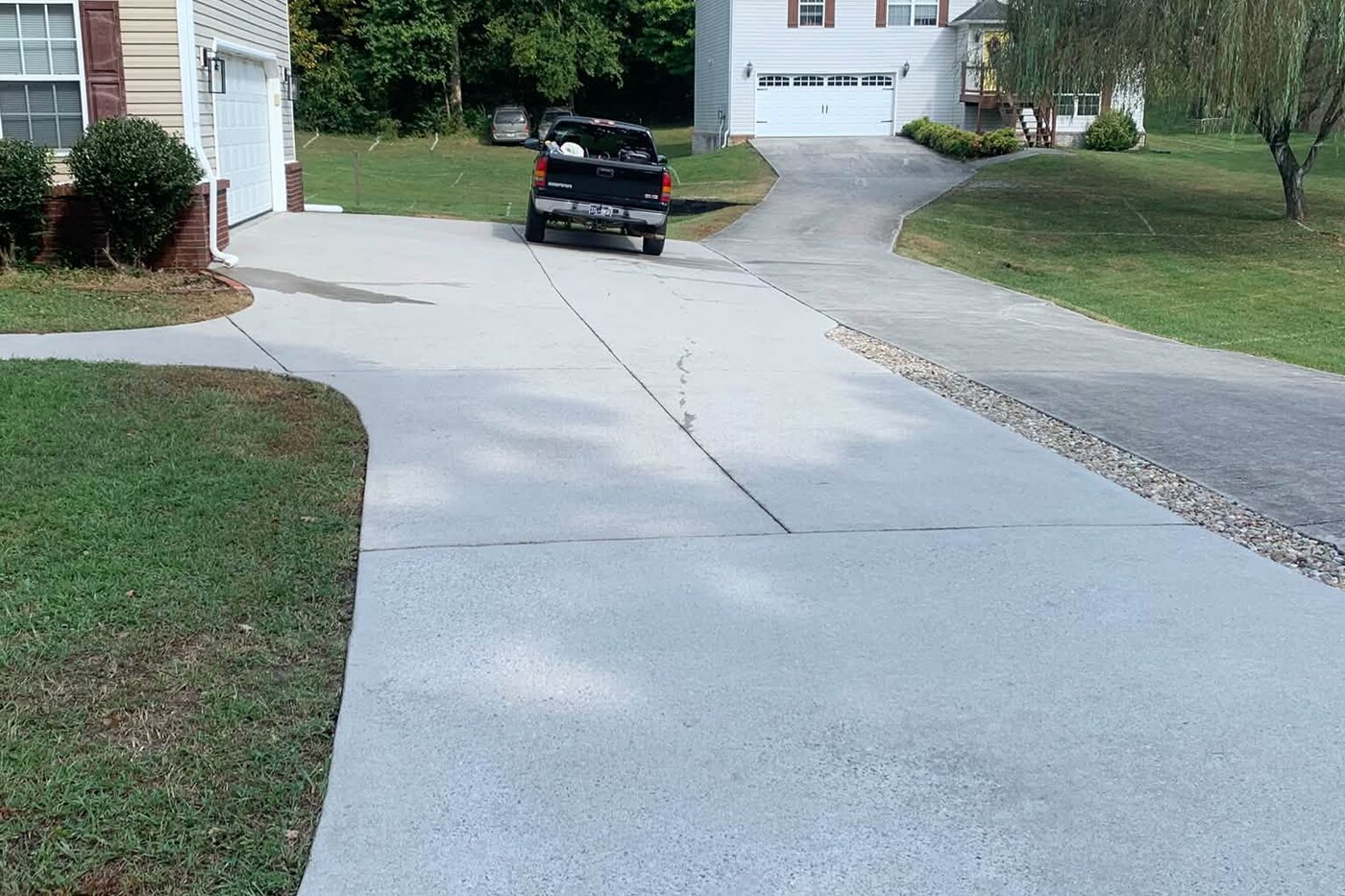 The same driveway after cleaning, the concrete back to an even pale grey