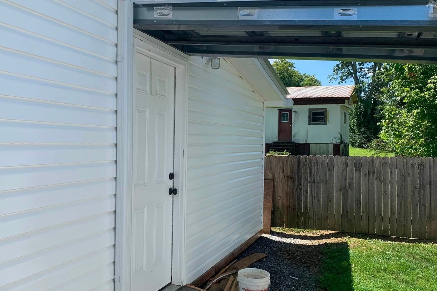 The same alley after washing, the siding back to clean white